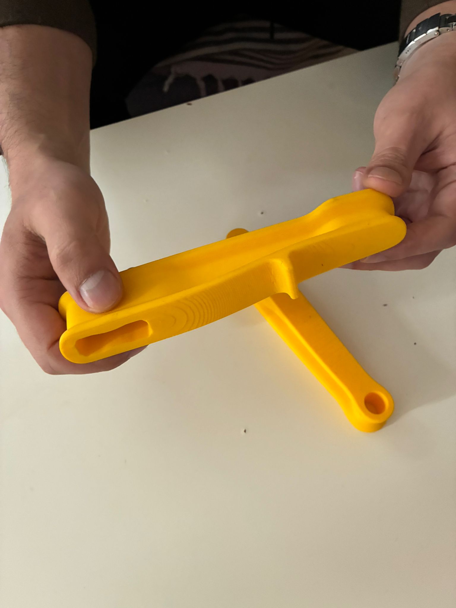 Bulut F-Clamp yellow prototype reviewed in hand for grip and proportion